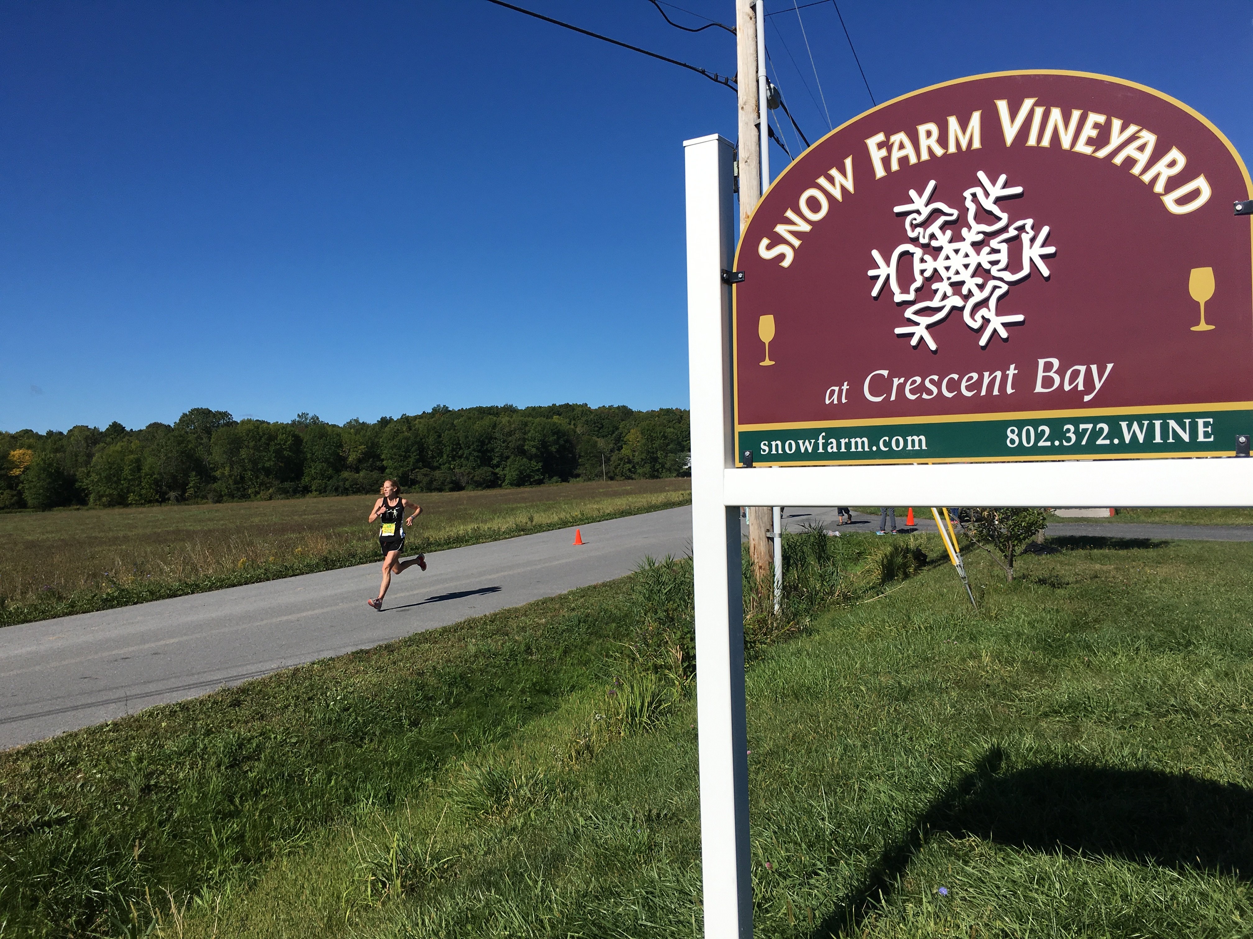 Vermont running Snow Farm Vinyard sign
